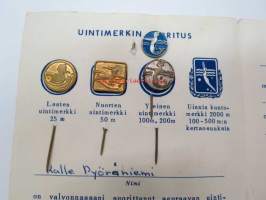 Uintikirja uintisuoritusmerkkeineen 1971-73