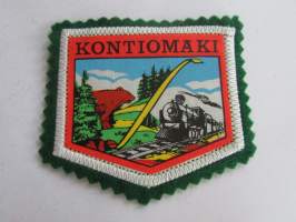 Kontiomäki -kangasmerkki / matkailumerkki / hihamerkki / badge -pohjaväri vihreä