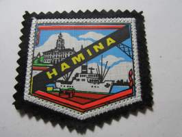 Hamina -kangasmerkki / matkailumerkki / hihamerkki / badge -pohjaväri musta