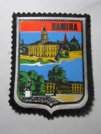 Hamina -kangasmerkki / matkailumerkki / hihamerkki / badge -pohjaväri musta