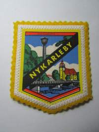 Nykarleby -kangasmerkki / matkailumerkki / hihamerkki / badge -pohjaväri keltainen