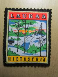Laukaa -Hietasyrjä -kangasmerkki / matkailumerkki / hihamerkki / badge -pohjaväri musta