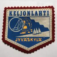 Keljonlahti -Jyväakylä -kangasmerkki / matkailumerkki / hihamerkki / badge -pohjaväri punainen