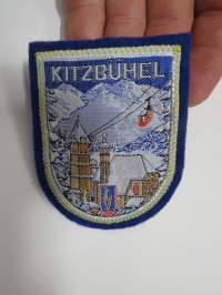 Kitsbühel -hihamerkki, kangasmerkki -matkamuistomerkki